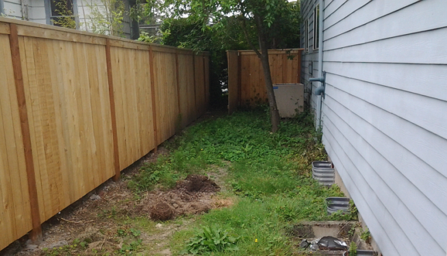 Side yard before custom built garden boxes