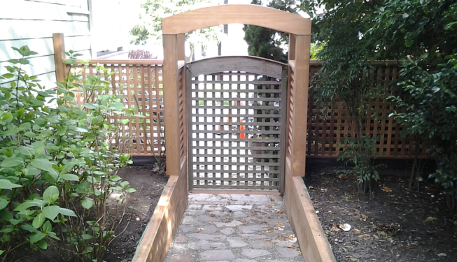 Rebuilt garden gate with custom arch