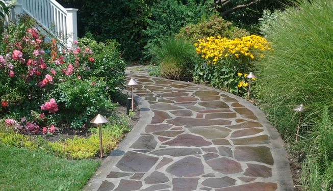 Stone pathway after repair with landscape lighting
